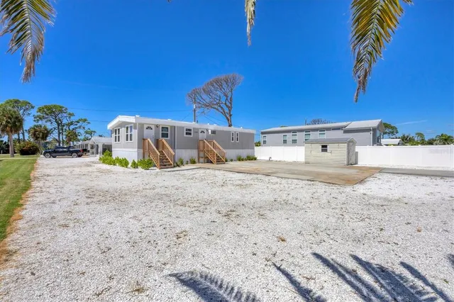 a view of a backyard of the house