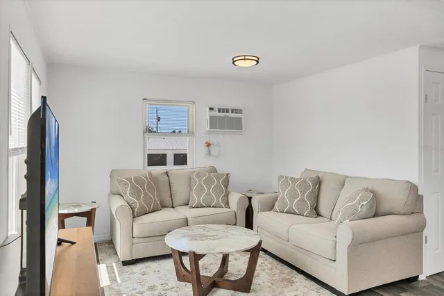 a living room with furniture a couch and a couch