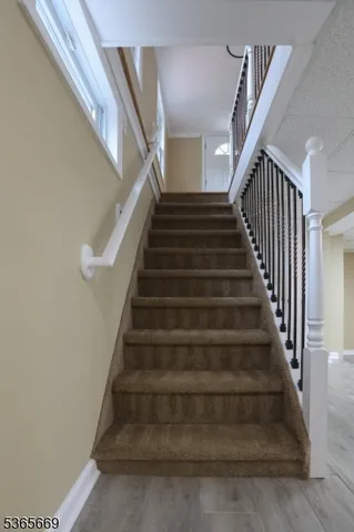 a backyard of a house with a yard and outdoor seating