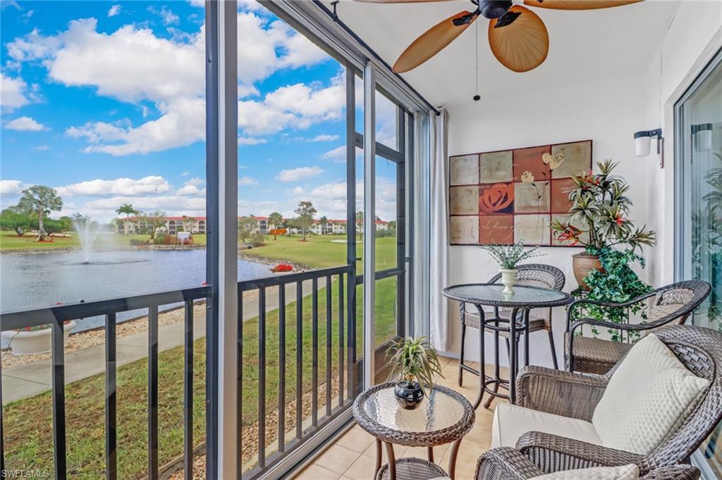 49 High Point Circle South, Unit 104 Naples, FL 34103 - Photo 2 of 30 a view of a balcony filled with furniture and a potted plant