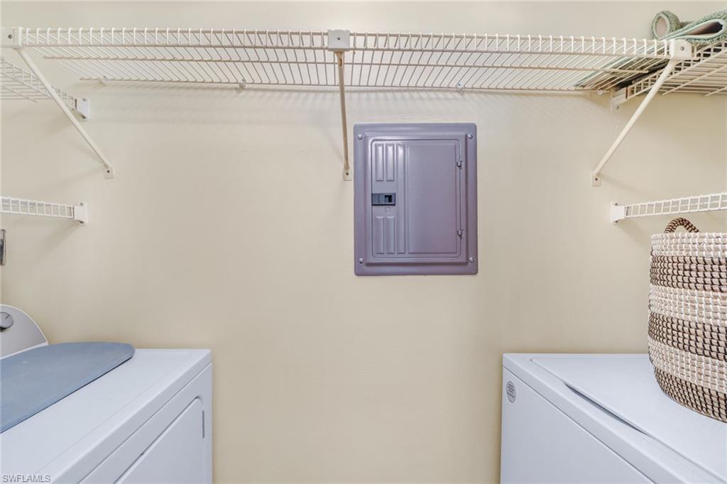 49 High Point Circle South, Unit 104 Naples, FL 34103 - Photo 23 of 30 a utility room with dryer and washer