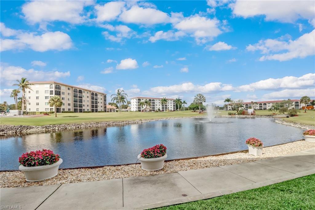 49 High Point Circle South, Unit 104 Naples, FL 34103 - Photo 25 of 30 a view of a lake