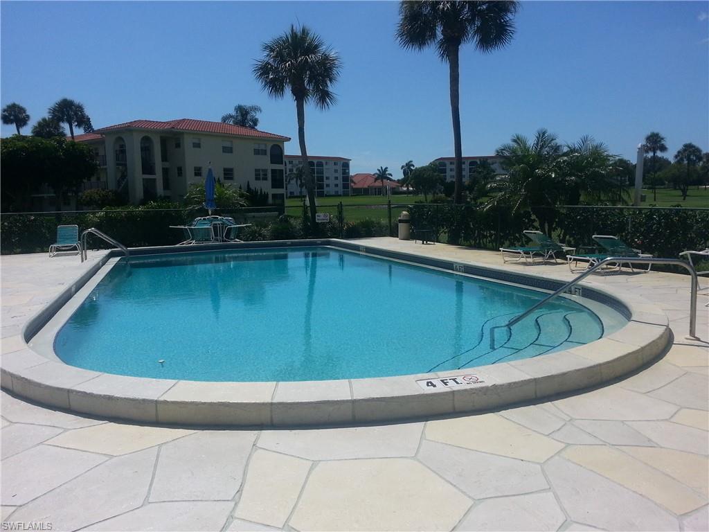 49 High Point Circle South, Unit 104 Naples, FL 34103 - Photo 26 of 30 a view of swimming pool
