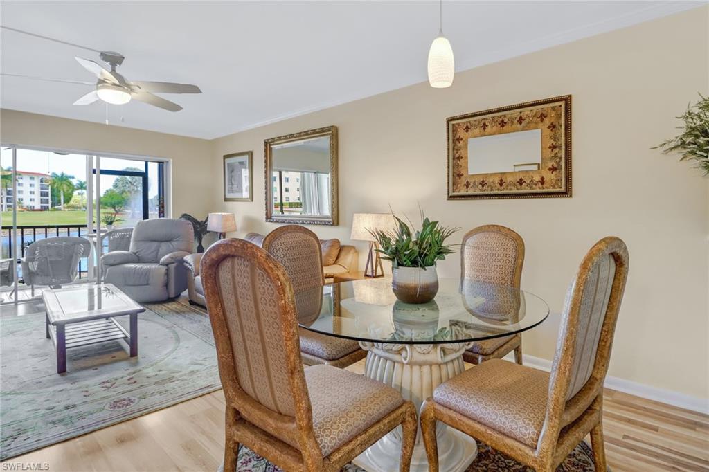 49 High Point Circle South, Unit 104 Naples, FL 34103 - Photo 10 of 30 a dining room with furniture and window