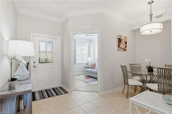 a view of a dining room with furniture and a livingroom