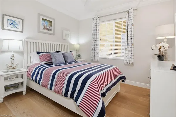 a bedroom with bed and a window
