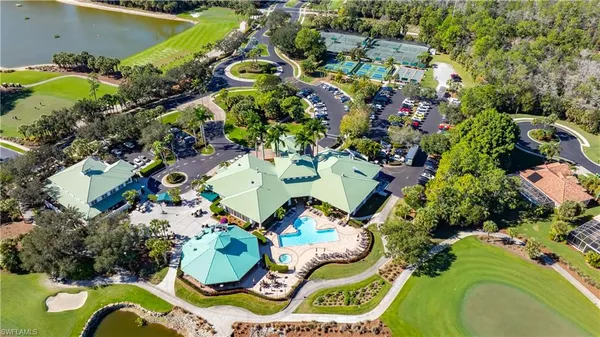 an aerial view of a swimming pool patio and outdoor seating