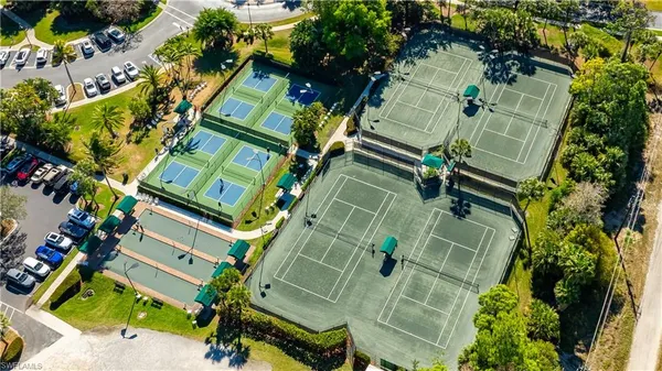 an aerial view of a residential apartment building with a yard