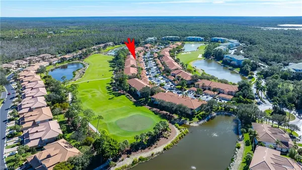 an aerial view of lake residential house with swimming pool and outdoor space