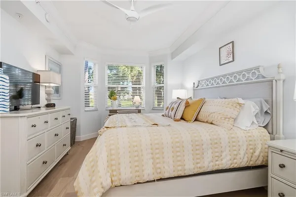 a large white bed in a white room