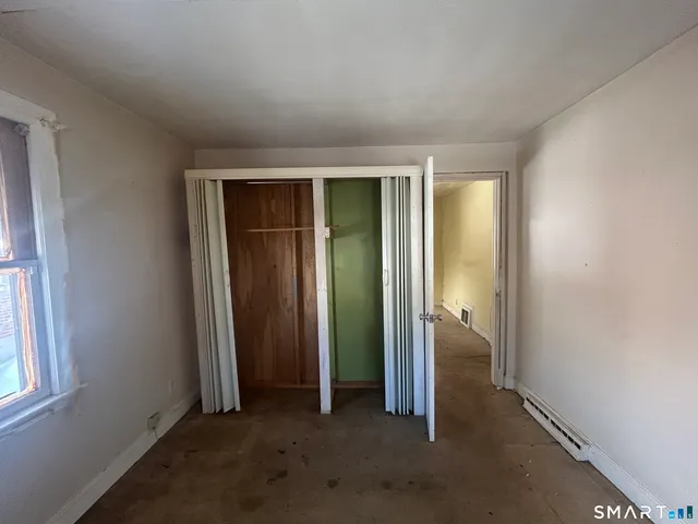 a view of a room that has a window in it