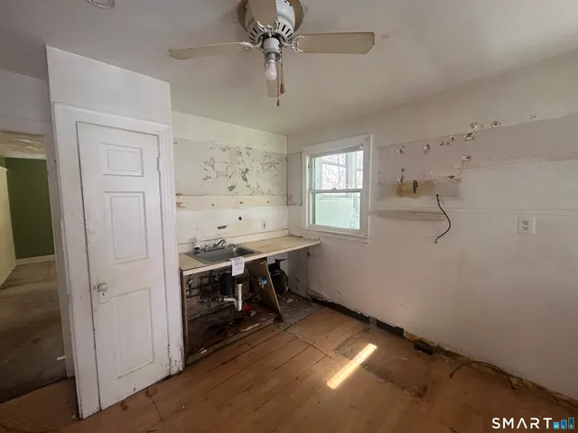 a view of an empty room with a window