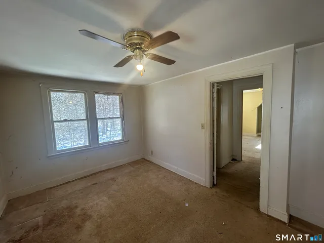 a view of an empty room with a window