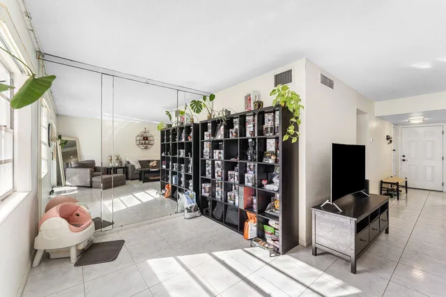 a living room with lots of furniture and a flat screen tv