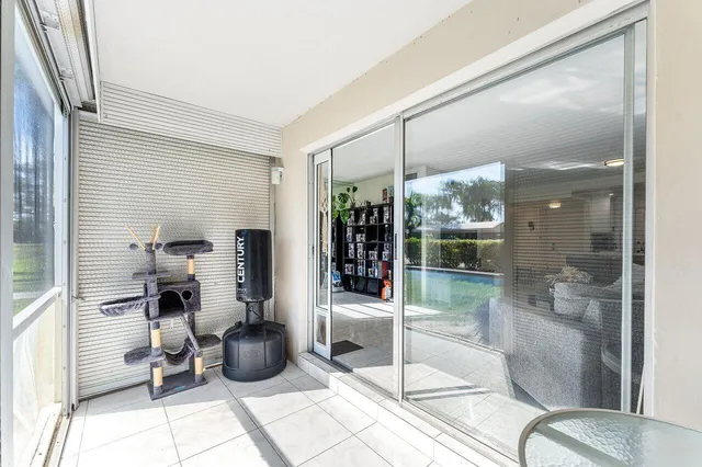 a room with lot of furniture and a chandelier