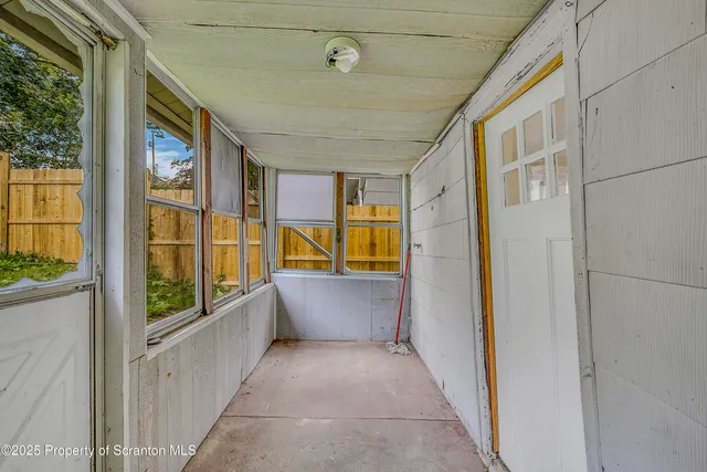 a view of walk in hallway with window