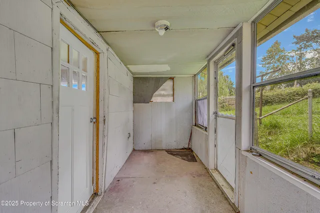 a view of hallway with windows