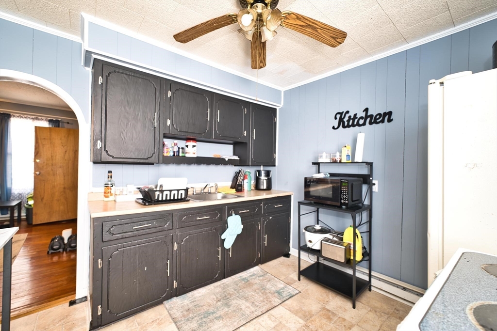 232 Alden Street Fall River, MA 02723 - Photo 11 of 34 a kitchen with a sink and cabinets
