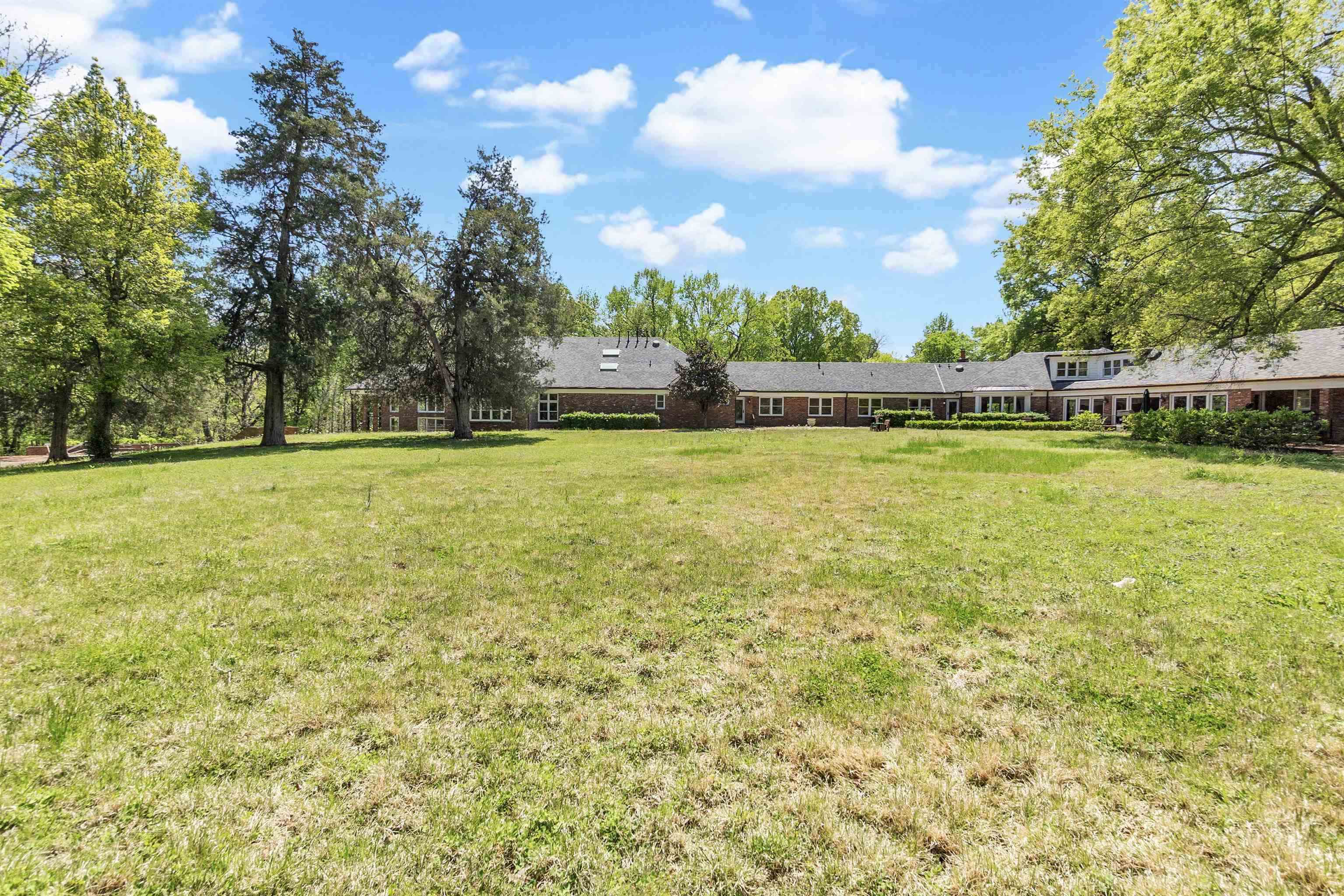 530 West Raines Road Memphis, TN 38109 - Photo 7 of 38 Expansive, level green space surrounded by mature trees