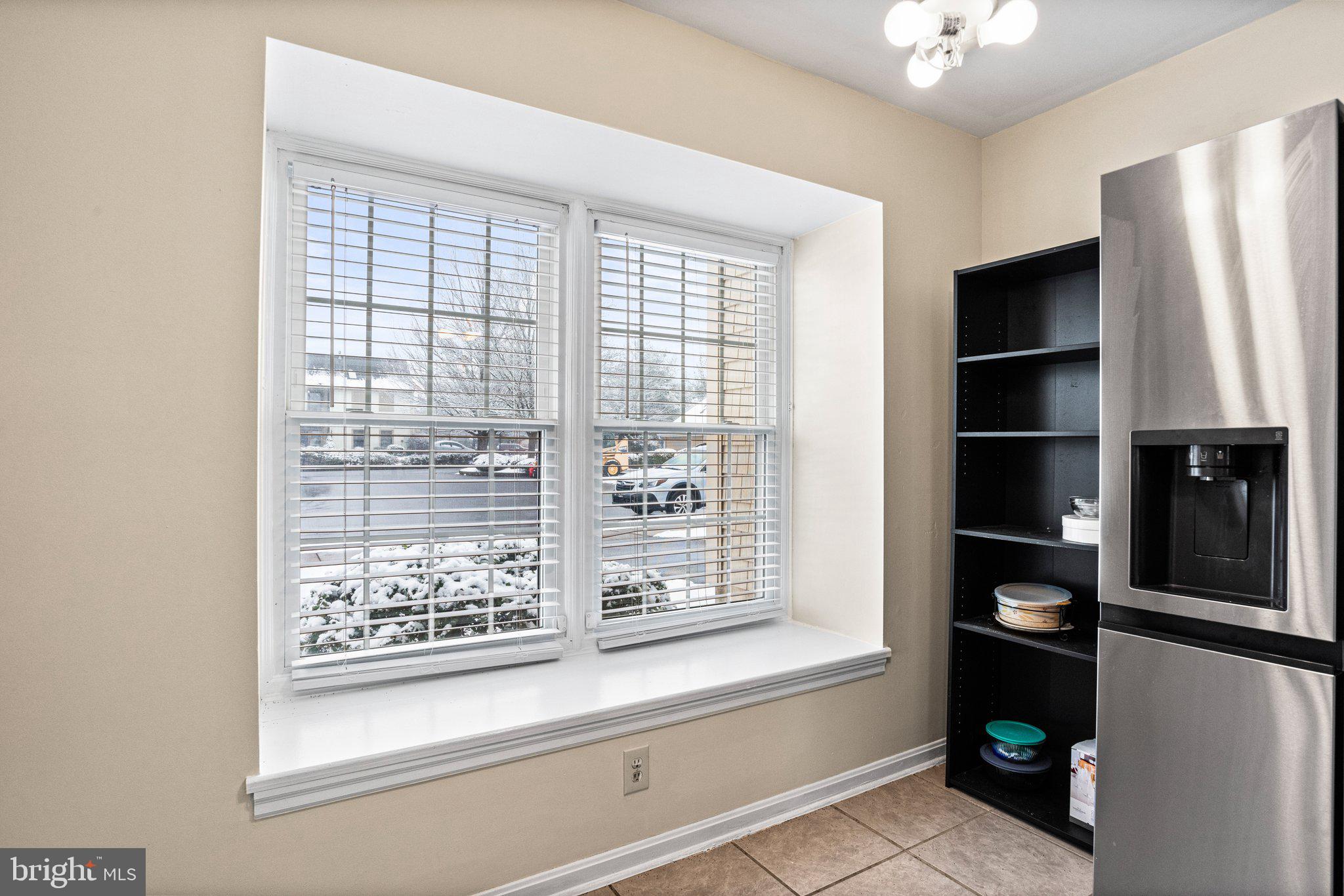 207 Crescent Drive Hershey, PA 17033 - Photo 17 of 42 a view of a kitchen with an empty shelves and refrigerator
