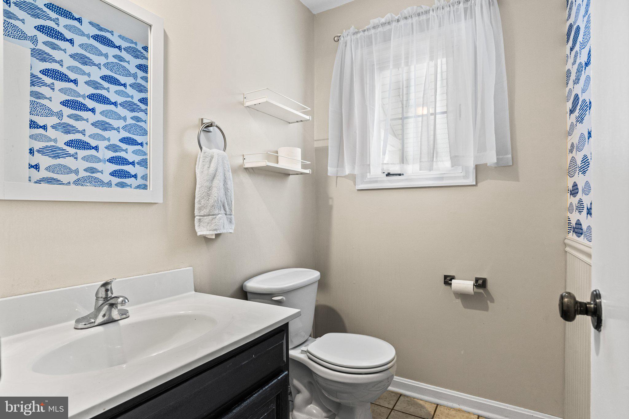 207 Crescent Drive Hershey, PA 17033 - Photo 19 of 42 a bathroom with a sink a toilet and a mirror