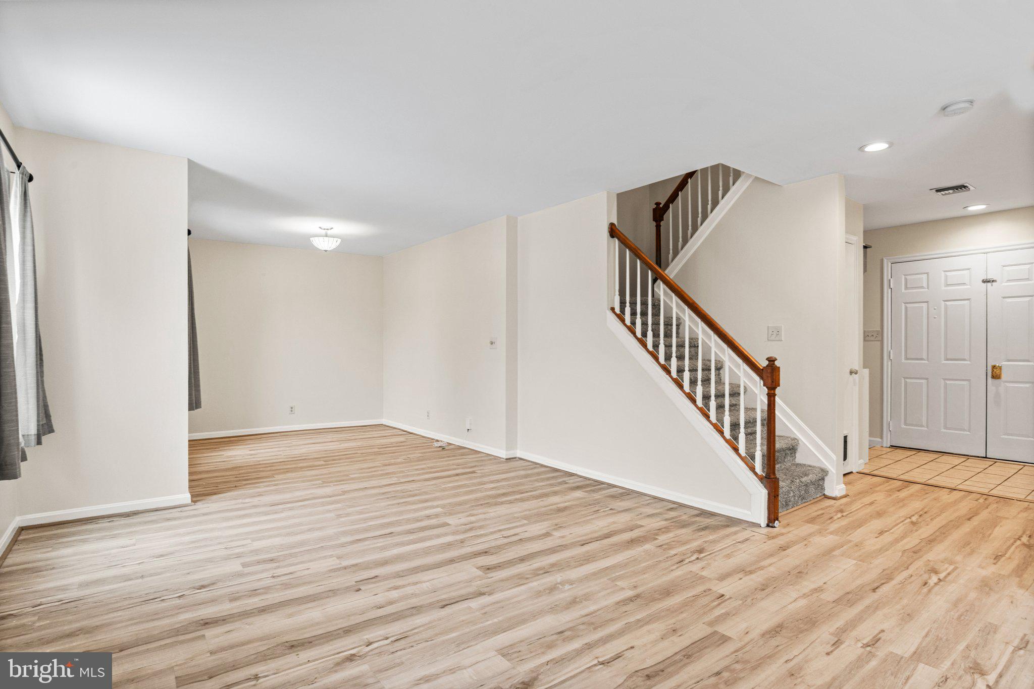 207 Crescent Drive Hershey, PA 17033 - Photo 5 of 42 a view of a hallway with wooden floor and staircase