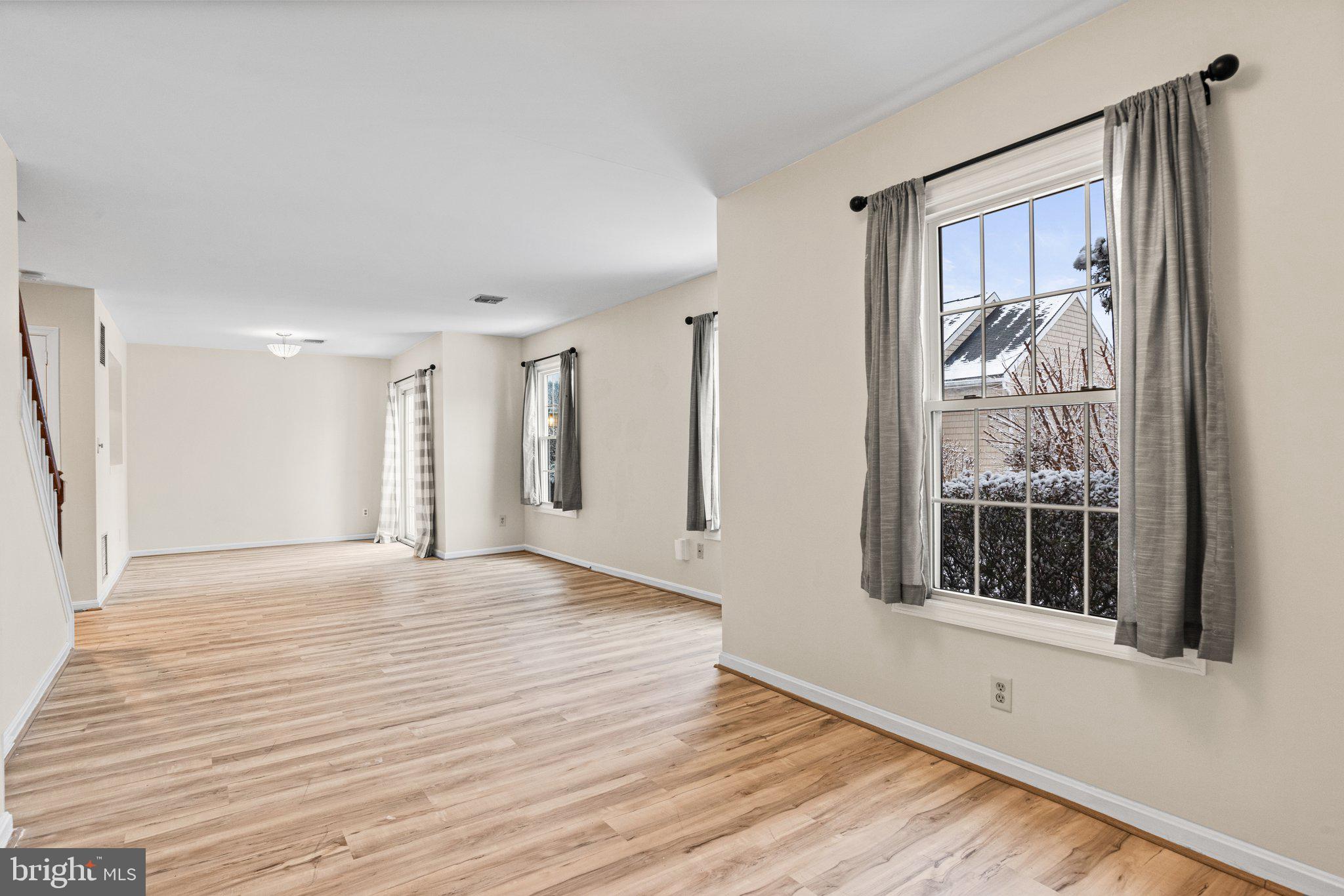 207 Crescent Drive Hershey, PA 17033 - Photo 7 of 42 a view of an empty room with a window and wooden floor
