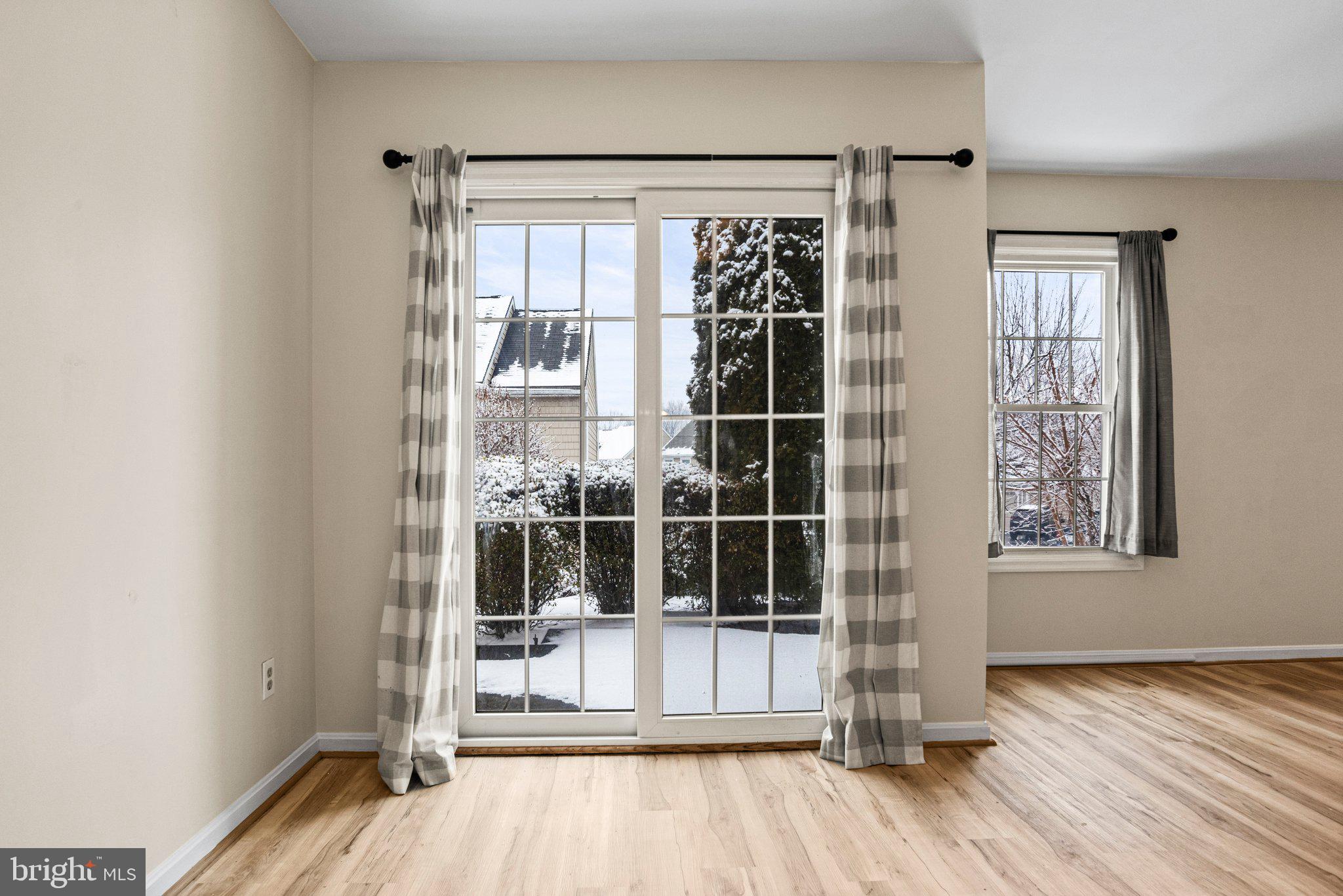 207 Crescent Drive Hershey, PA 17033 - Photo 9 of 42 an empty room with wooden floor and windows