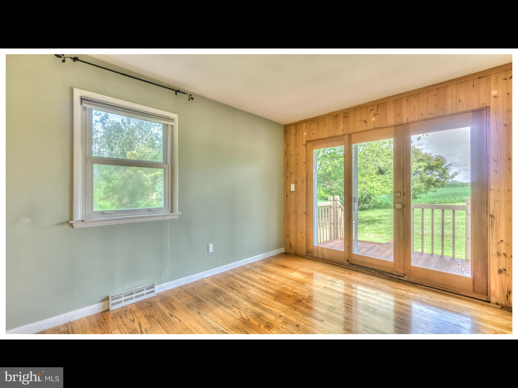 2207 Watervale Road Fallston, MD 21047 - Photo 8 of 30 a view of an empty room with wooden floor and a window