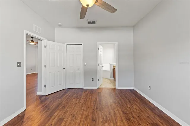 a view of an empty room and wooden floor