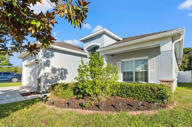front view of a house with a yard