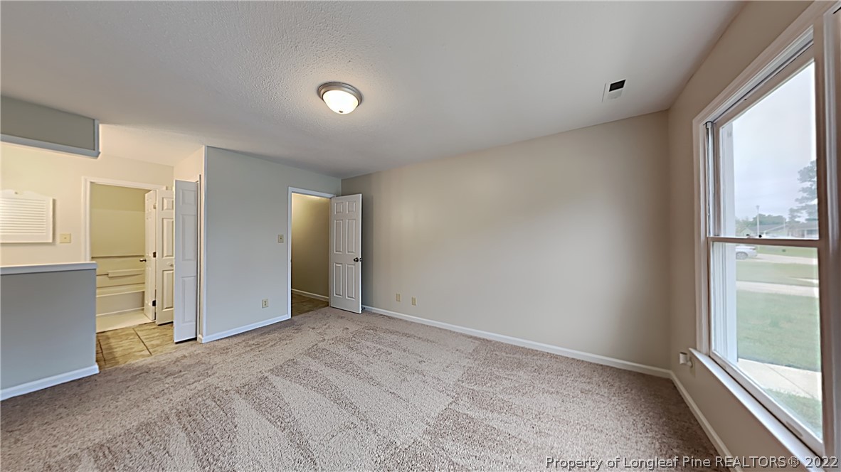 1112 Hoke Loop Road Fayetteville, NC 28314 - Photo 7 of 14 a view of empty room with window
