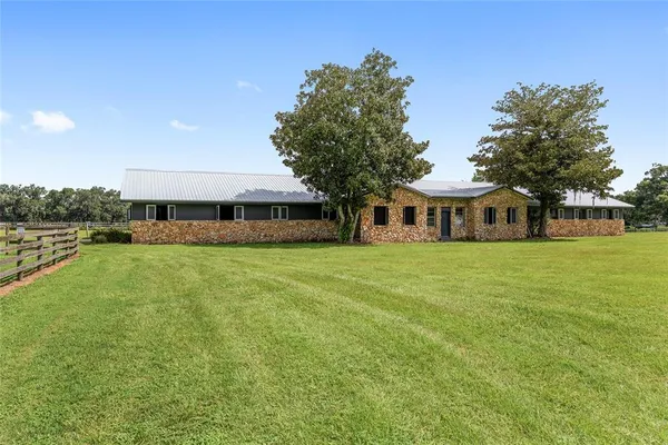 a view of a house with a big yard