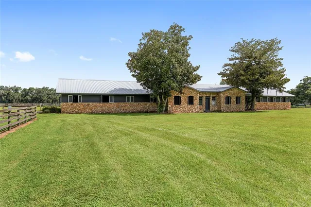 a view of a house with a big yard