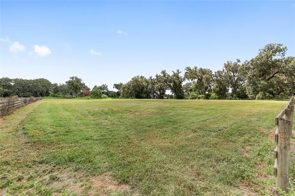 a view of a swimming pool with an ocean view