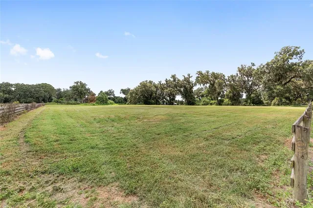 a view of a swimming pool with an ocean view