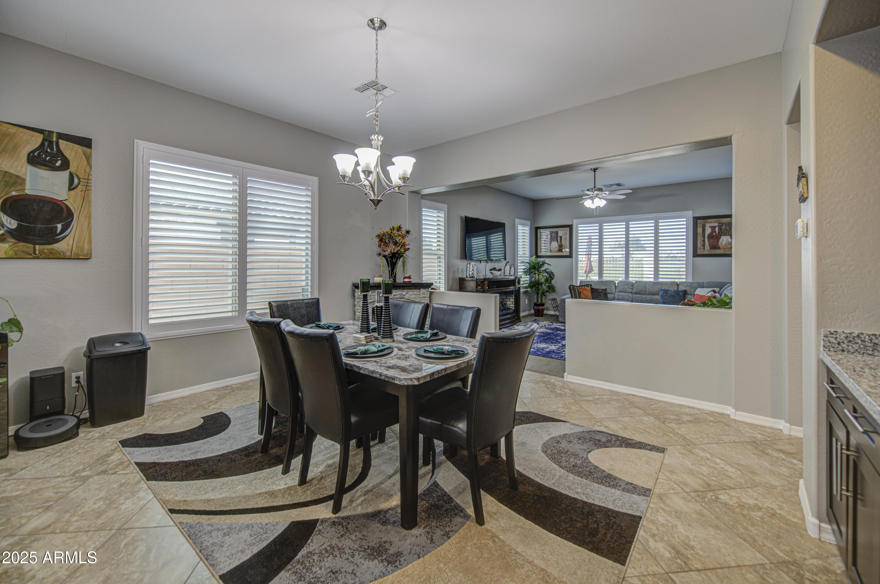 14304 West Coronado Road Goodyear, AZ 85395 - Photo 23 of 66 a view of a dining room with furniture and chandelier