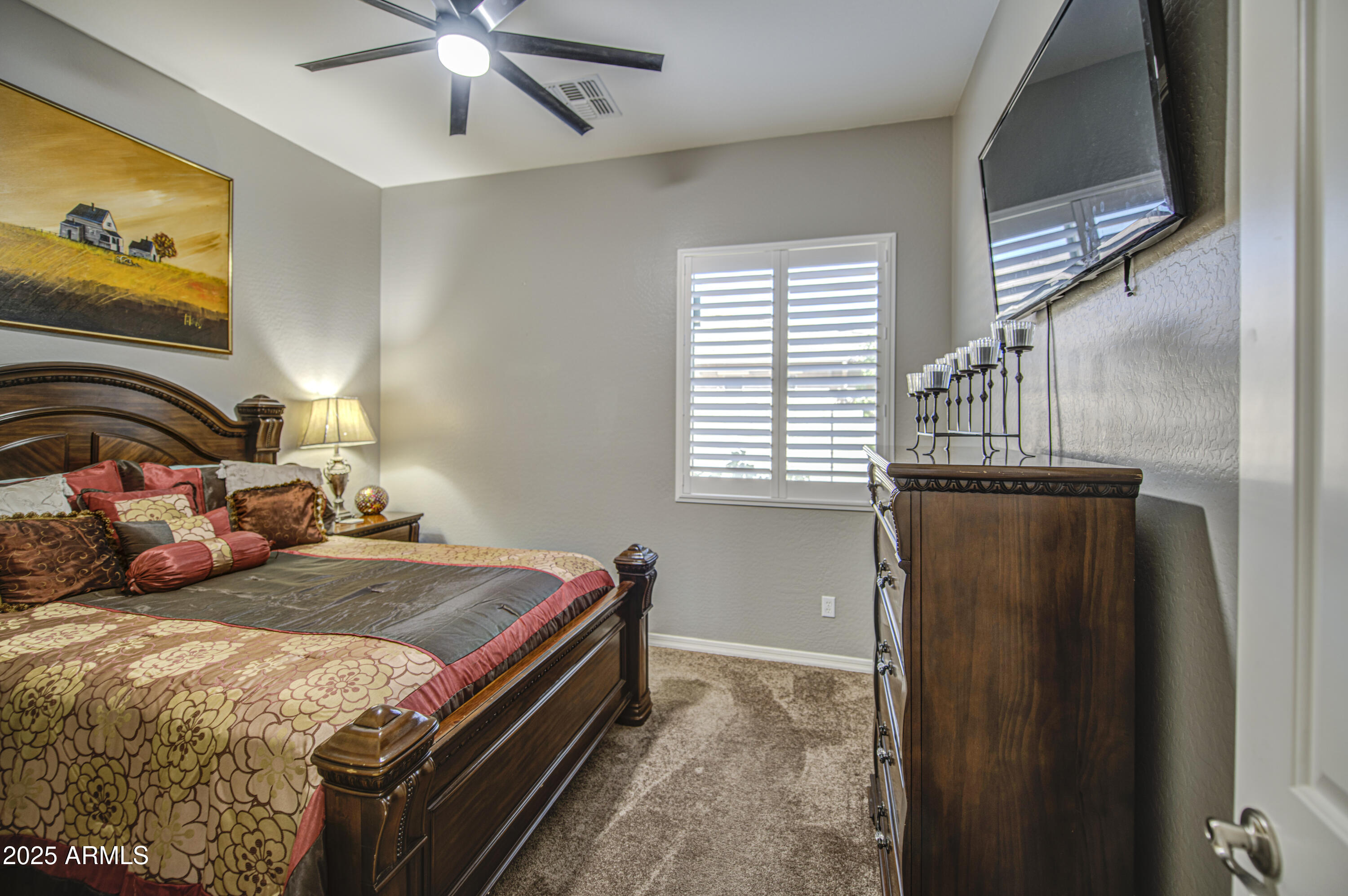14304 West Coronado Road Goodyear, AZ 85395 - Photo 32 of 66 a bedroom with a bed and a window