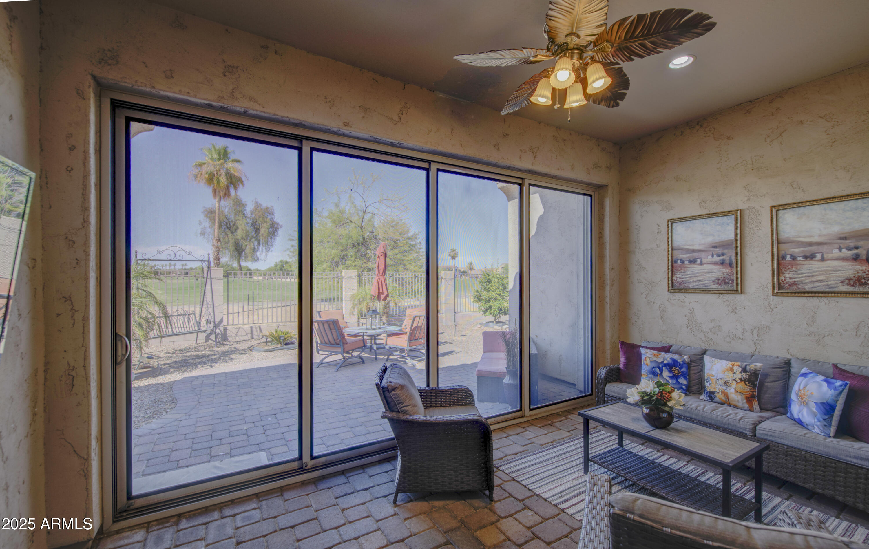 14304 West Coronado Road Goodyear, AZ 85395 - Photo 38 of 66 a living room with furniture and a large window
