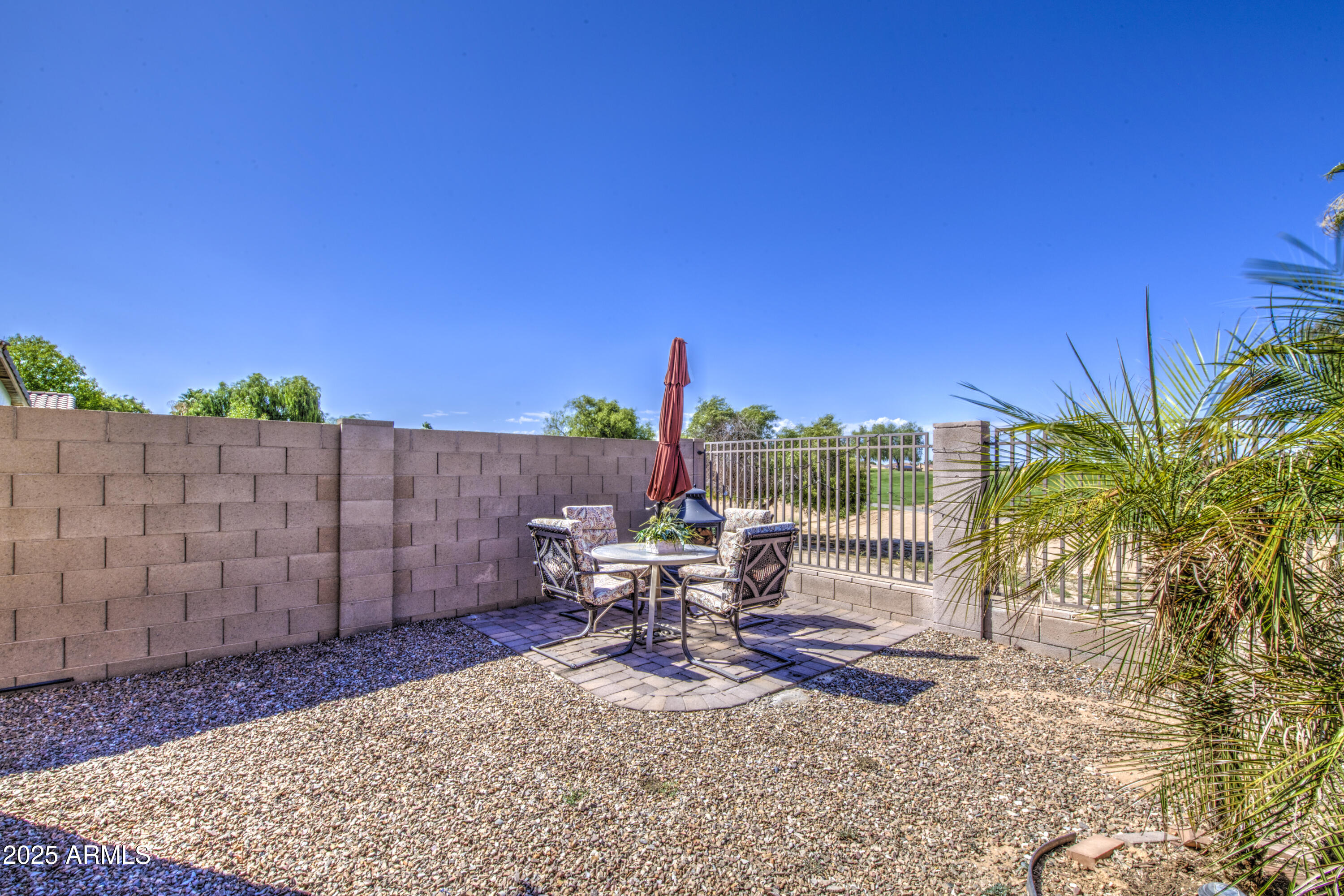 14304 West Coronado Road Goodyear, AZ 85395 - Photo 39 of 66 a view of a patio with a table and chairs