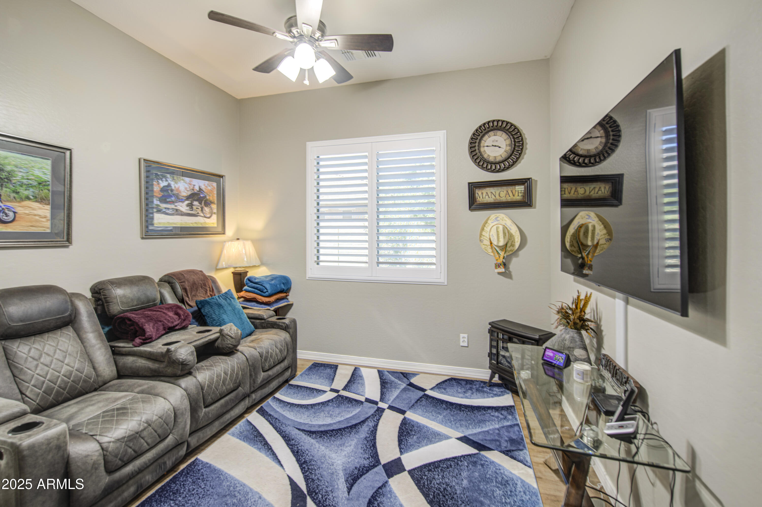 14304 West Coronado Road Goodyear, AZ 85395 - Photo 49 of 66 a living room with furniture and a window