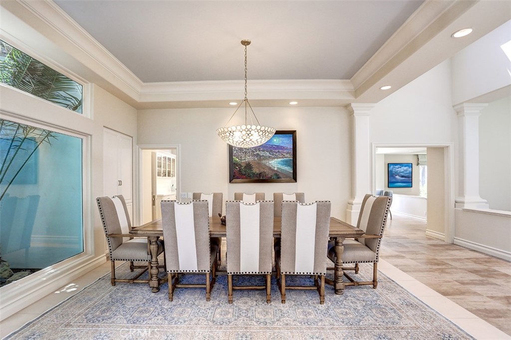 27 Marbella Dana Point, CA 92629 - Photo 12 of 66 a dining room with furniture a chandelier and window