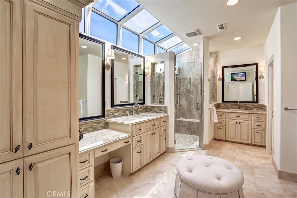 27 Marbella Dana Point, CA 92629 - Photo 20 of 66 a spacious bathroom with a double vanity sink a mirror and a bathtub
