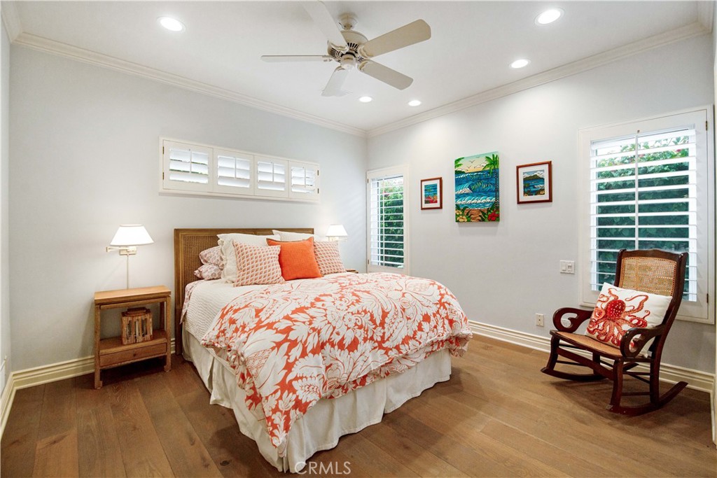 27 Marbella Dana Point, CA 92629 - Photo 21 of 66 a bedroom with a bed and a chair