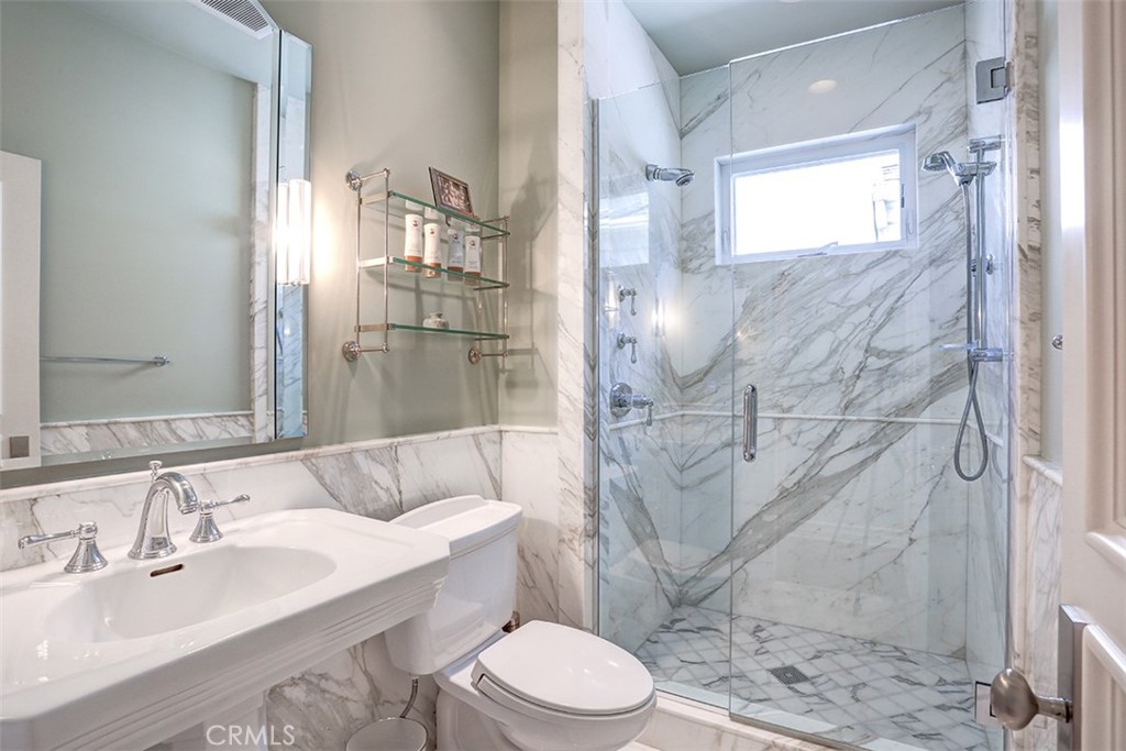 27 Marbella Dana Point, CA 92629 - Photo 29 of 66 a bathroom with a sink toilet and shower