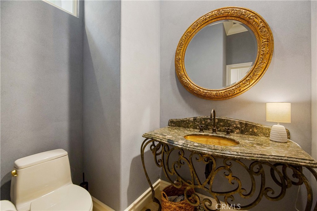 27 Marbella Dana Point, CA 92629 - Photo 33 of 66 a bathroom with a sink a toilet and a mirror