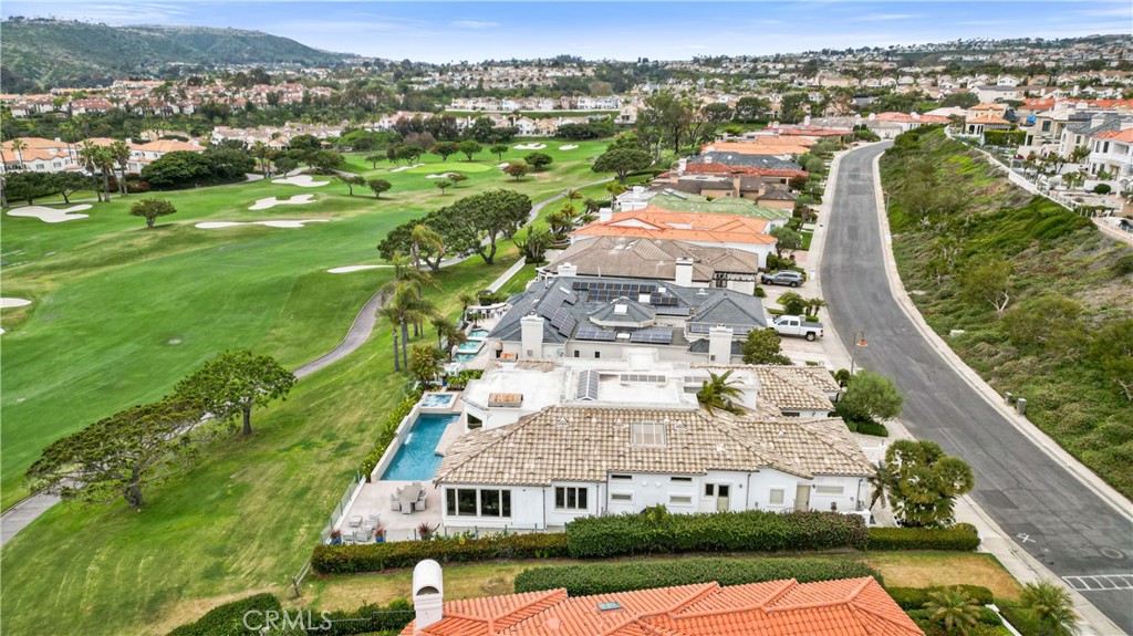 27 Marbella Dana Point, CA 92629 - Photo 37 of 66 an aerial view of residential houses with outdoor space and trees
