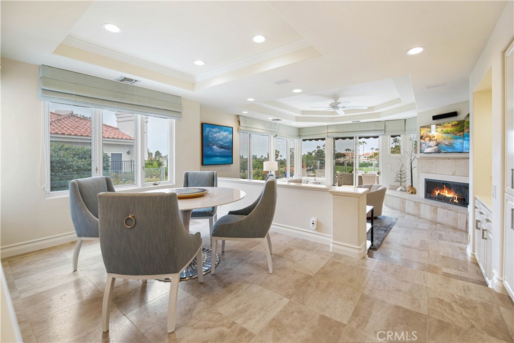 27 Marbella Dana Point, CA 92629 - Photo 46 of 66 a living room with a couch and a dining table with kitchen view