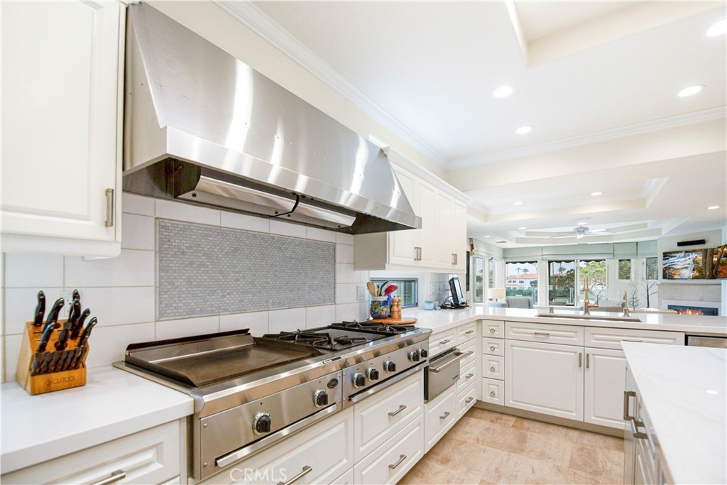 27 Marbella Dana Point, CA 92629 - Photo 49 of 66 a kitchen with stainless steel appliances granite countertop a stove and a sink