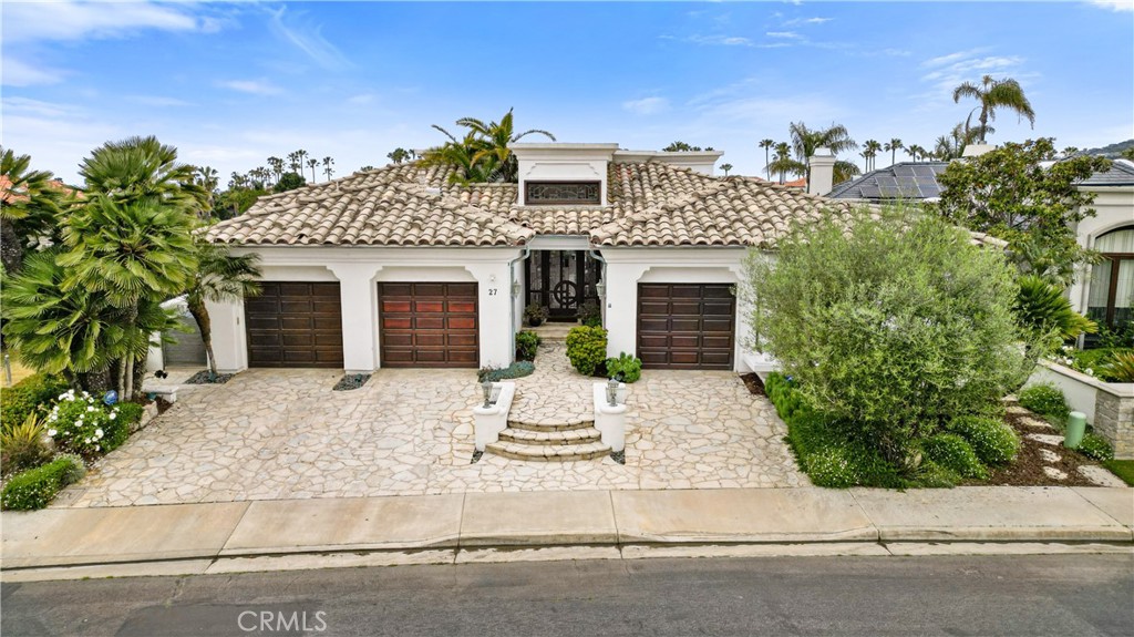 27 Marbella Dana Point, CA 92629 - Photo 62 of 66 front view of a house with a yard